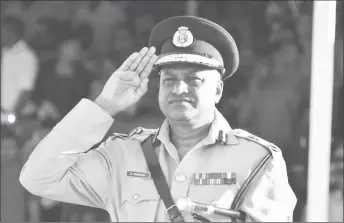  ?? (DPI photo) ?? Top Cop Seelall Persaud taking the final salute