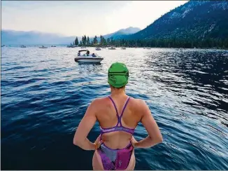  ??  ?? Lauren Lubus scans Lake Tahoe before the start of the Trans Tahoe Relay on July 21.