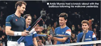  ??  ?? Andy Murray had a knock-about with the ballboys following his walkover yesterday.