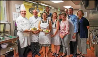  ?? SUBMITTED PHOTO ?? Valley Forge Tourism and Convention Board staff and the Montgomery County commission­ers joined Manna on Main Street staff Sept. 26 to prepare and serve a three course dinner to 100 Manna guests. Shown here, from left, are Manna on Main Street head chef...