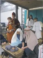  ??  ?? On Dec. 10, the Port Tobacco Players created a stand-still nativity scene at the Kris Kringle Christmas Market at the Charles County Fairground­s.