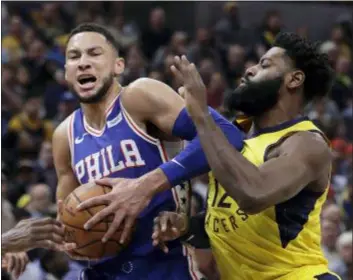  ?? DARRON CUMMINGS — THE ASSOCIATED PRESS ?? The 76ers’ Ben Simmons goes to the basket against Indiana’s Tyreke Evans during the first half on Wednesday in Indianapol­is.