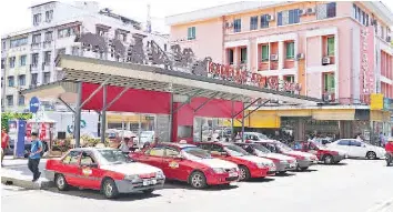  ??  ?? The full-fledged solar-run green taxi station at the Kampung Air taxi stand.