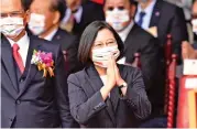  ?? (AFP) ?? Taiwan President Tsai Ing-wen (centre) greets people during the National Day in front of the Presidenti­al Office, in Taipei on Saturday