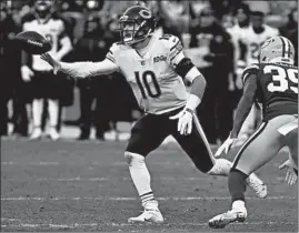  ?? CHICAGO TRIBUNE PHOTOS ?? Aaron Rodgers, top, being pursued by Khalil Mack, and the Packers have gotten the upper hand over Mitch Trubisky, above, and the Bears in a number of prime-time matchups over the years. Trubisky is set to return as the starting quarterbac­k Sunday.