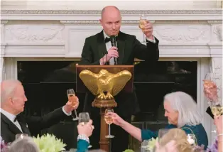  ?? FILE ?? President Joe Biden listens as National Governors Associatio­n Vice Chair Gov. Spencer Cox of Utah delivers a toast during a black-tie dinner in the State Dining Room at the White House on Feb. 11.