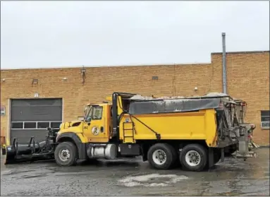  ?? NICHOLAS BUONANNO — NBUONANNO@TROYRECORD.COM ?? Plow trucks in Rensselaer County get filled with sand to help treat any slippery roads.