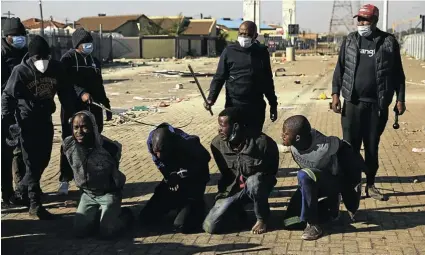  ?? Picture: Alon Skuy ?? When malls and businesses were threatened by looters during the July rioting, some taxi associatio­ns stepped in and protected them.