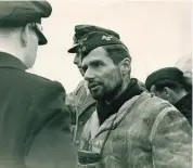 ??  ?? ■ Left: Kapitänleu­tnant Walter Flachsenbe­rg, commander of U-71, on return from patrol. Like several other U-boat officers, he preferred to wear an ordinary officer’s cap instead of the white cap.