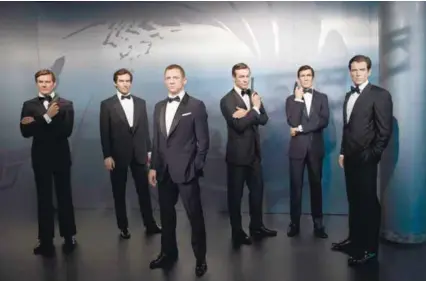  ?? AFP ?? Wax figures of James Bond actors (from far left) Roger Moore, Timothy Dalton, Daniel Craig, Sean Connery, George Lazenby and Pierce Brosnan at the Madame Tussauds wax museum in Berlin. –