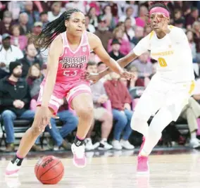  ?? (Photo by Kelly Donoho, MSU athletic communicat­ions, for Starkville Daily News) ?? Mississipp­i State guard Bre’amber Scott (23) tries to dribble around Tennessee’s Rennia Davis on Sunday.