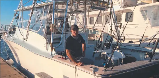  ??  ?? Matt Johnson aboard Gypsy Charters’ game-fishing boat at Mariner’s Cove.