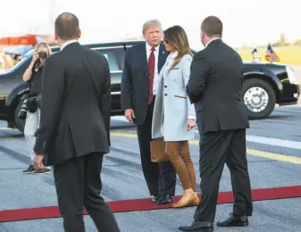  ?? Doug Mills / New York Times ?? President Trump, arriving in Vantaa, Finland, in July with first lady Melania Trump, has withdrawn the U.S. from internatio­nal agreements and imposed tariffs on trading partners.