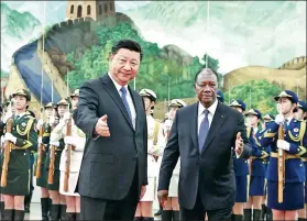  ?? FENG YONGBIN / CHINA DAILY ?? President Xi Jinping accompanie­s Cote d’Ivoire President Alassane Ouattara in the Great Hall of the People in Beijing on Thursday.