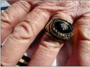  ?? Michelle Wilson / RN-T ?? Former Pepperell football coach David Jones shows off his team’s state championsh­ip ring.