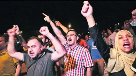  ?? BURHAN OZBILICI/THE ASSOCIATED PRESS ?? Turkish people protest against the attempted military coup in Ankara late Friday. Reports said military leadership was not unified in seeking a coup.