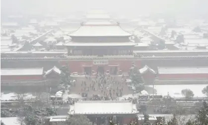  ?? Photograph: Ng Han Guan/AP ?? Snow covers the Forbidden City in Beijing. Temperatur­es in the city fell below -10C as a cold wave swept much of China.