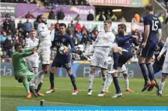  ??  ?? SWANSEA: Swansea City’s English defender Kyle Bartley (2L) blocks a shot from Tottenham Hotspur’s Spanish striker Fernando Llorente (3R) during the English FA Cup quarter-final football match between Swansea City and Tottenham Hotspur at The Liberty...