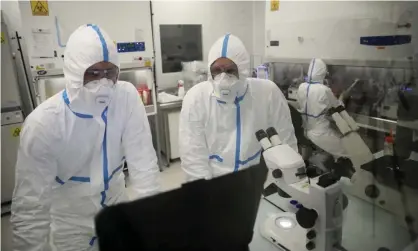  ?? Photograph: David Vincent/AP ?? Laboratory technician­s at Valneva’s headquarte­rs in Saint-Herblain, western France.