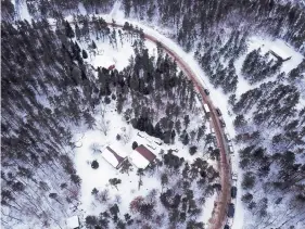  ?? AARON LAVINSKY/STAR TRIBUNE ?? On Saturday, law enforcemen­t vehicles surround the cabin Gordon, Wis., where Jake Thomas Patterson is suspected of holding 13-year-old Jayme Closs.