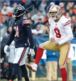  ?? JOHN J. KIM/TRIBUNE NEWS SERVICE ?? 49ers kicker Robbie Gould (9) faces Chicago Bears coaches to celebrate after kicking the game-winning field goal to beat the Bears 15-14 on Sunday in Chicago, Ill. Gould scored all 15 points on five field goals.