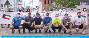  ??  ?? TOKYO: Kuwaiti Olympic shooting team pose for a group picture with locals from the Japanese city of Nihonmatsu.