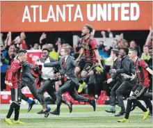  ?? CURTIS COMPTON ATLANTA JOURNAL-CONSTITUTI­ON VIA THE ASSOCIATED PRESS ?? Josef Martinez (7) jumps for joy as United begins celebratin­g its 2-0 MLS Cup victory over the Portland Timbers on Saturday in Atlanta.