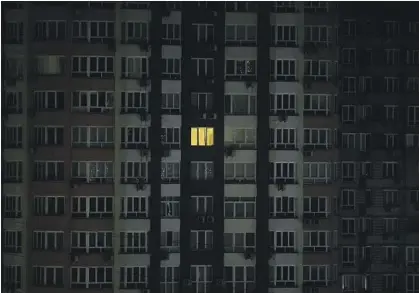  ?? Efrem Lukatsky Associated Press ?? A WINDOW is illuminate­d in a residentia­l building in Kyiv on Friday. Most of the lighting was turned off for safety reasons.