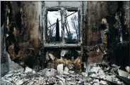  ?? COSTAS BALTAS / REUTERS ?? The interior of a burnt house is seen following a wildfire in the village of Mati, near Athens, Greece, on Saturday.