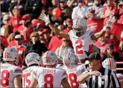  ?? Tribune News Service/columbus Dispatch ?? Ohio State wide receiver Chris Olave (2) celebrates after catching a 3-yard touchdown pass in the second quarter against Nebraska on Saturday, Nov. 6, 2021, at Memorial Stadium in Lincoln, Nebraska.