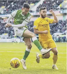  ??  ?? 0 Hibs’ Stephen Mcginn and Livingston’s Steven Lawless.