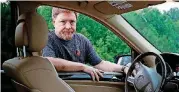  ??  ?? John Carroll poses alongside his 2010 Mercedes-Benz ML 350 sport utility vehicle, which contains a driver’s side Takata air bag inflator that has been recalled, in Perry Hall, Md. Carroll is waiting for parts in order for his recalled inflator to be...