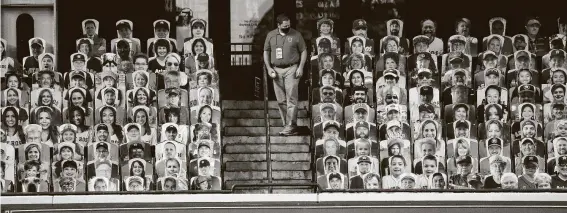  ?? Karen Warren / Staff photograph­er ?? None of the cardboard cutouts in the Crawford Boxes moved to catch Yuli Gurriel’s home run ball Saturday, so an Astros employee had to retrieve it.