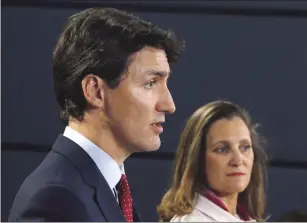  ?? CP PHOTO PATRICK DOYLE ?? Prime Minister Justin Trudeau and Foreign Affairs Minister Chrystia Freeland speak at a press conference in Ottawa on Thursday, May 31, 2018. A new analysis of escalating trade disputes involving the United States warns that a deteriorat­ion into an all-out, global trade war would knock North America’s economies into recession.