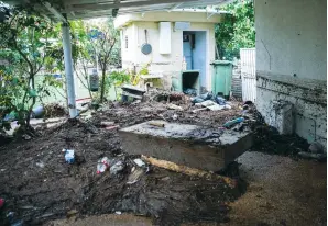  ?? ( Yossi Aloni/ Flash90) ?? SOME OF the flood damage and debris outside a home in Ness Ziona following heavy rainfall yesterday.