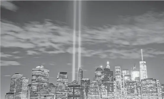  ?? Drew Angerer / Getty Images ?? “Tribute in Light” representi­ng the fallen World Trade Center towers rises from Lower Manhattan. The New York Fire Department lost 300 firefighte­rs on Sept. 11, 2001.