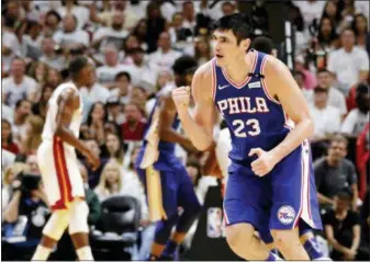  ?? JOE SKIPPER — THE ASSOCIATED PRESS ?? Philadelph­ia 76ers forward Ersan Ilyasova (23) reacts scoring during the third quarter against the Miami Heat in Game 4 of a first-round NBA basketball playoff series, Saturday in Miami.