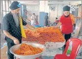  ?? AFP ?? Sikh devotees prepare ‘jalebi’ on the occasion of the Guru Nanak’s wedding anniversar­y at Gurdwara Kandh Sahib in Batala on Wednesday. The gurdwara derives its name from ‘kachchi kand, or mud wall, which, according to local tradition, stood on this site at the time of Guru Nanak’s wedding. ■