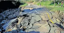  ?? | THEO JEPTHA African News Agency (ANA) ?? A DAMAGED road in Mariannrid­ge, Pinetown, after the floods two weeks ago. Opposition parties in eThekwini Municipali­ty want the city to pay for the damage to some homes as they said this was due to the poor condition of infrastruc­ture.