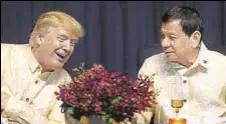  ?? AFP ?? Donald Trump and Rodrigo Duterte in conversati­on at a celebratio­n dinner for the Asean Summit in Manila on Sunday.