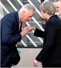  ?? AP ?? EU chief Brexit negotiator Michel Barnier greets British Prime Minister Theresa May in Brussels on Friday. —