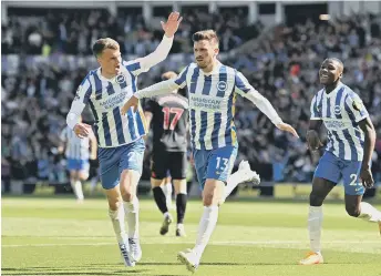  ?? ?? Pascal Gross celebrates with teammates - before his goal was chalked off by VAR