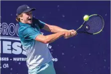  ?? ?? American Jenson Brooksby looks to return a backhand shot during the Bakersfiel­d Tennis Open singles finals in 2019.