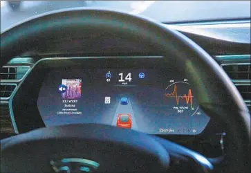  ?? Chris Walker Chicago Tribune ?? A NEW VERSION of Tesla’s Navigate on Autopilot system can change lanes without driver confirmati­on.