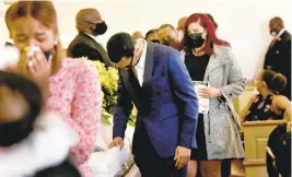  ?? STEPHEN M. KATZ/STAFF PHOTOS ?? Friends and family of Sierra Jenkins bid their final farewells during her celebratio­n of life service Saturday at the Metropolit­an Funeral Home on Granby Street in Norfolk.