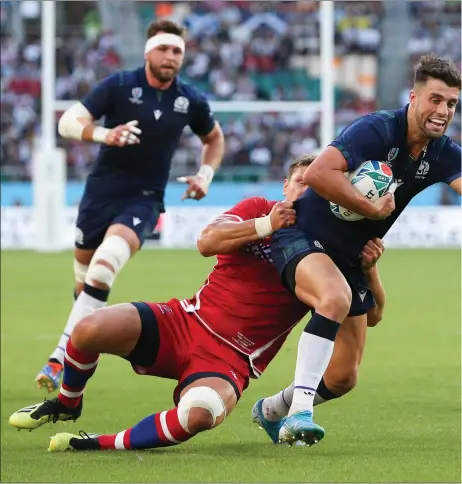  ??  ?? Adam Hastings scores Scotland’s first try against Russia, while below left, Jamie Ritchie congratula­tes George Horne