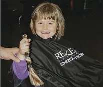  ??  ?? Back in 2013 Donna Falconer snapped five-year-old charity volunteer Elizabeth Butcherine as she donated 28 centimetre­s of her hair to the children’s charity, Variety. PHOTO: DONNA FALCONER