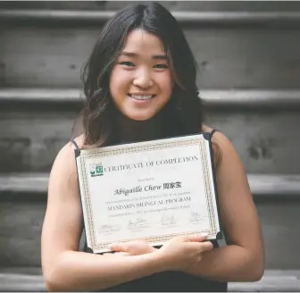  ?? JASON PAYNE ?? Abby Chow is a Grade 12 student at Gleneagle secondary school in Coquitlam. She entered the first year of the district's Mandarin immersion program in Grade 1, and is now part of its first graduating class.