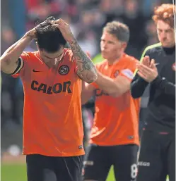  ??  ?? A dejected Paul Paton, John Rankin and Simon Murray after United’s relegation is confirmed.