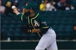  ?? MATT YORK — THE ASSOCIATED PRESS ?? OAklAnd Athletics pitcher Sergio Romo throws AgAinst the SAn Diego PAdres during the first inning of A spring trAining gAme MArch 12.